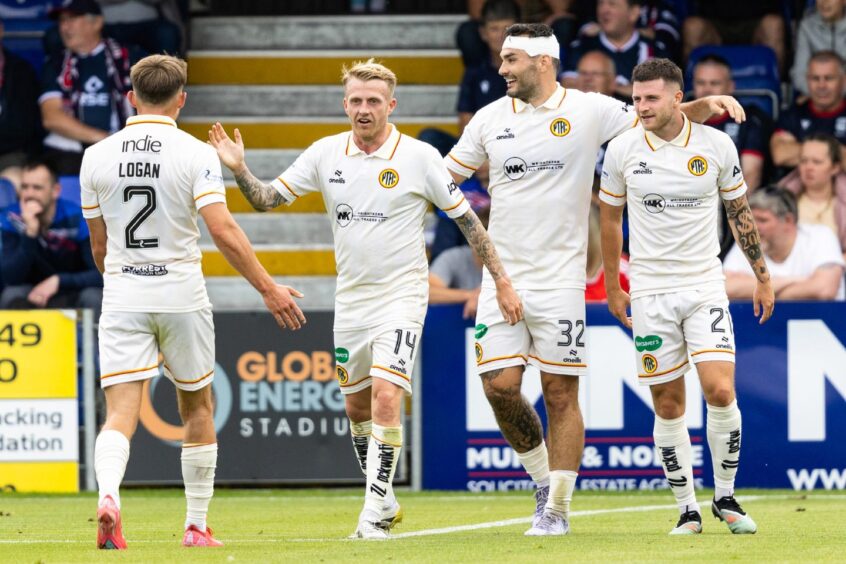 Left to right: Partick Thistle's Robbie Crawford, Tony Watt and Aidan Fitzpatrick celebrate after Crawford opened the scoring against Ross County just before half-time in their 3-1 win in the Premier Sports Cup at the Global Energy Stadium, Dingwall, on July 26, 2025. 
