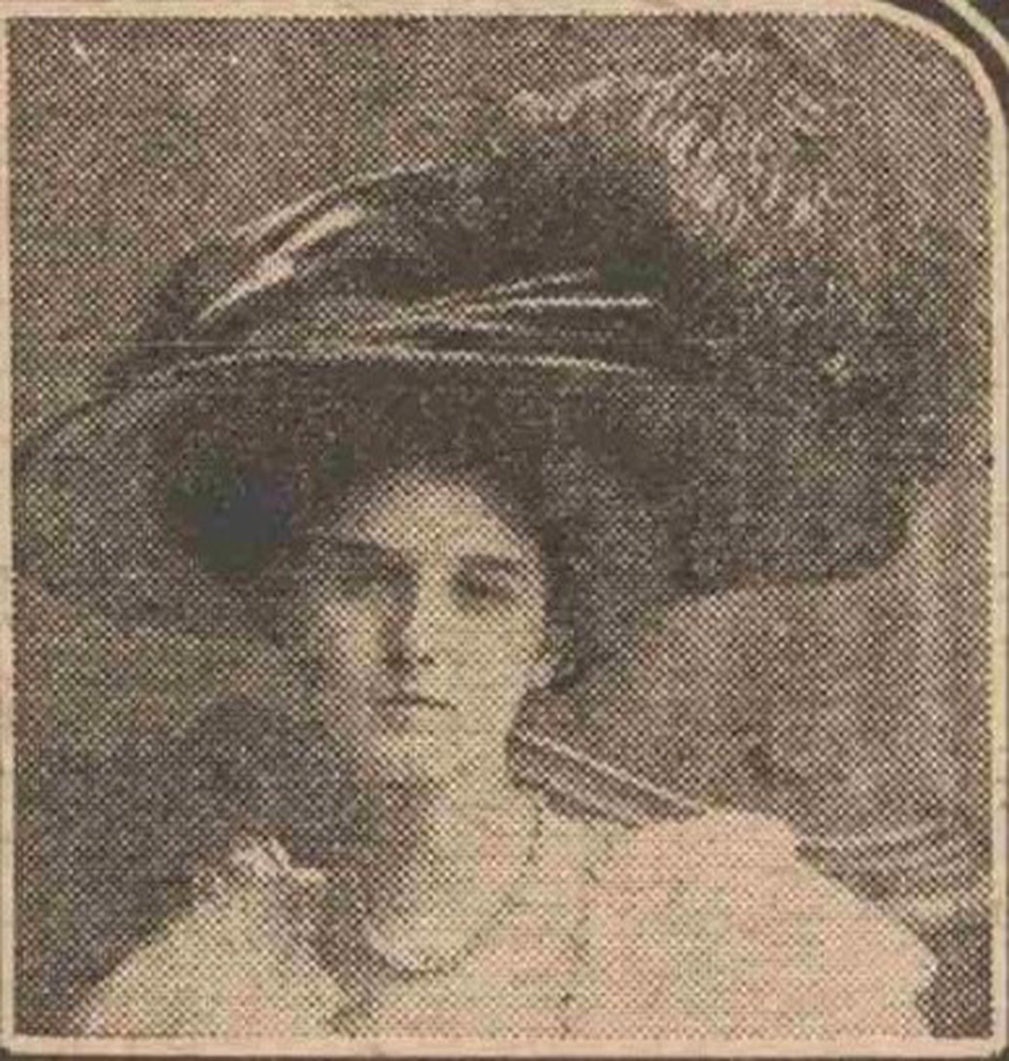An old profile photo of Violet Charlesworth, wearing a large hat.