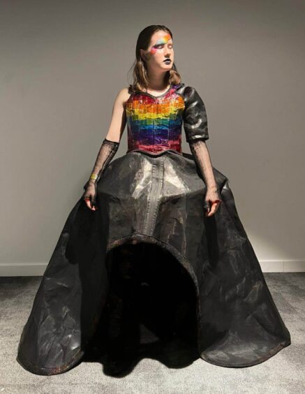 Orla in one of her creations, with a rainbow theme.