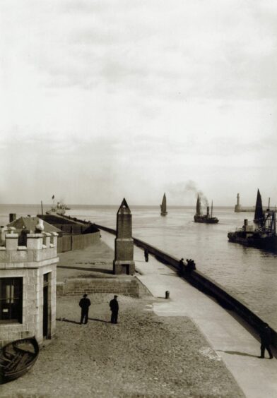 The entrance to Aberdeen Harbour taken from the North Pier in the early 1900s