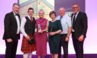 Shona Marshall, third from the left, holding the award for best large butcher in Scotland.