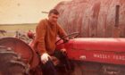 Orkney farmer Charlie Gorn on his Massey Ferguson tractor.