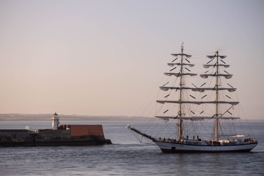 The Fryderyk Chopin, a twin-masted long boat, arrives at Aberdeen harbour for the Tall Ships Races.