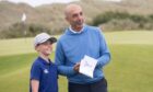 Former Chelsea footballer Roberto Di Matteo poses for a photo wiht a young fan at Trump International Links. Image: Darrell Benns/DC Thomson.