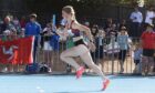 Emily McArthur on running track.