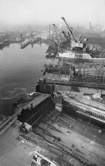 Aberdeen's bustling harbour with the new dry docks, part of Hall Russell shipyard, in the foreground in 1974.