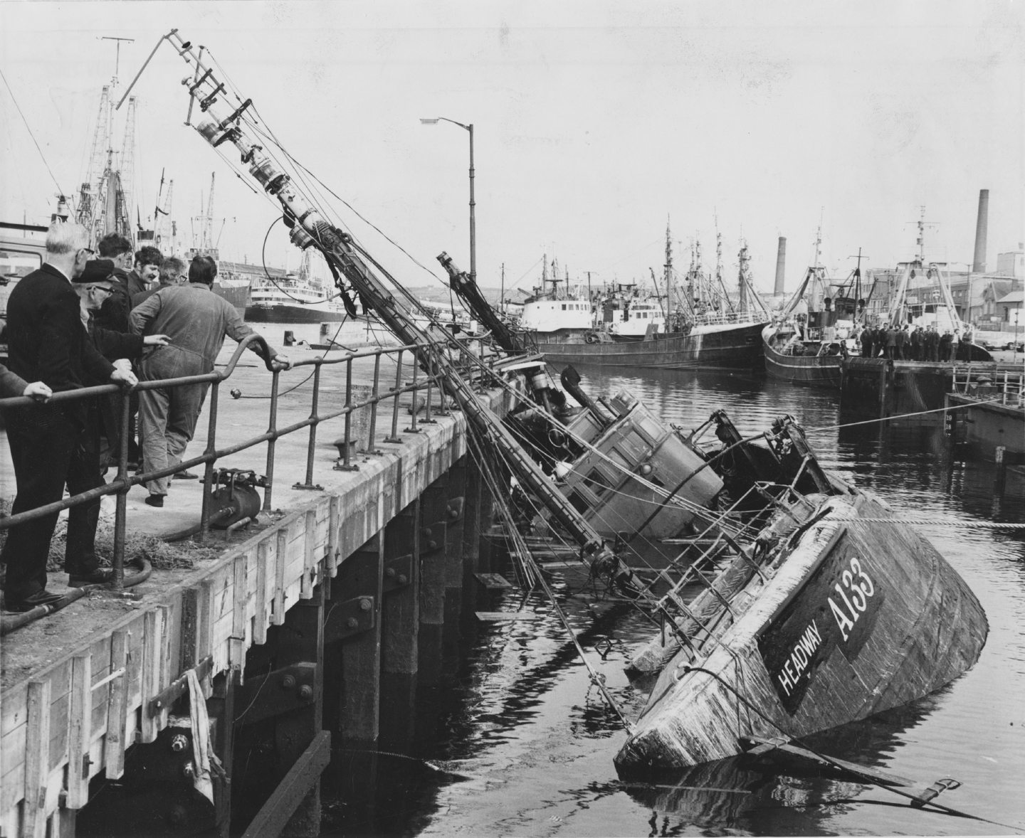 The Aberdeen trawler Headway when it keeled over in a pontoon dock at Aberdeen Harbour and smashed against the pontoon jetty