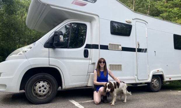 Fiona Campbell with her two-year-old dog Luna and her motorhome. Image: Supplied by Fiona Campbell