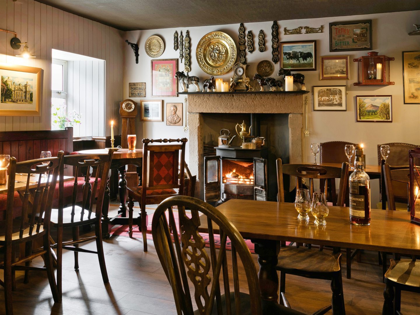 The cosy bar has a fireplace and an eclectic selection of wall decorations.
