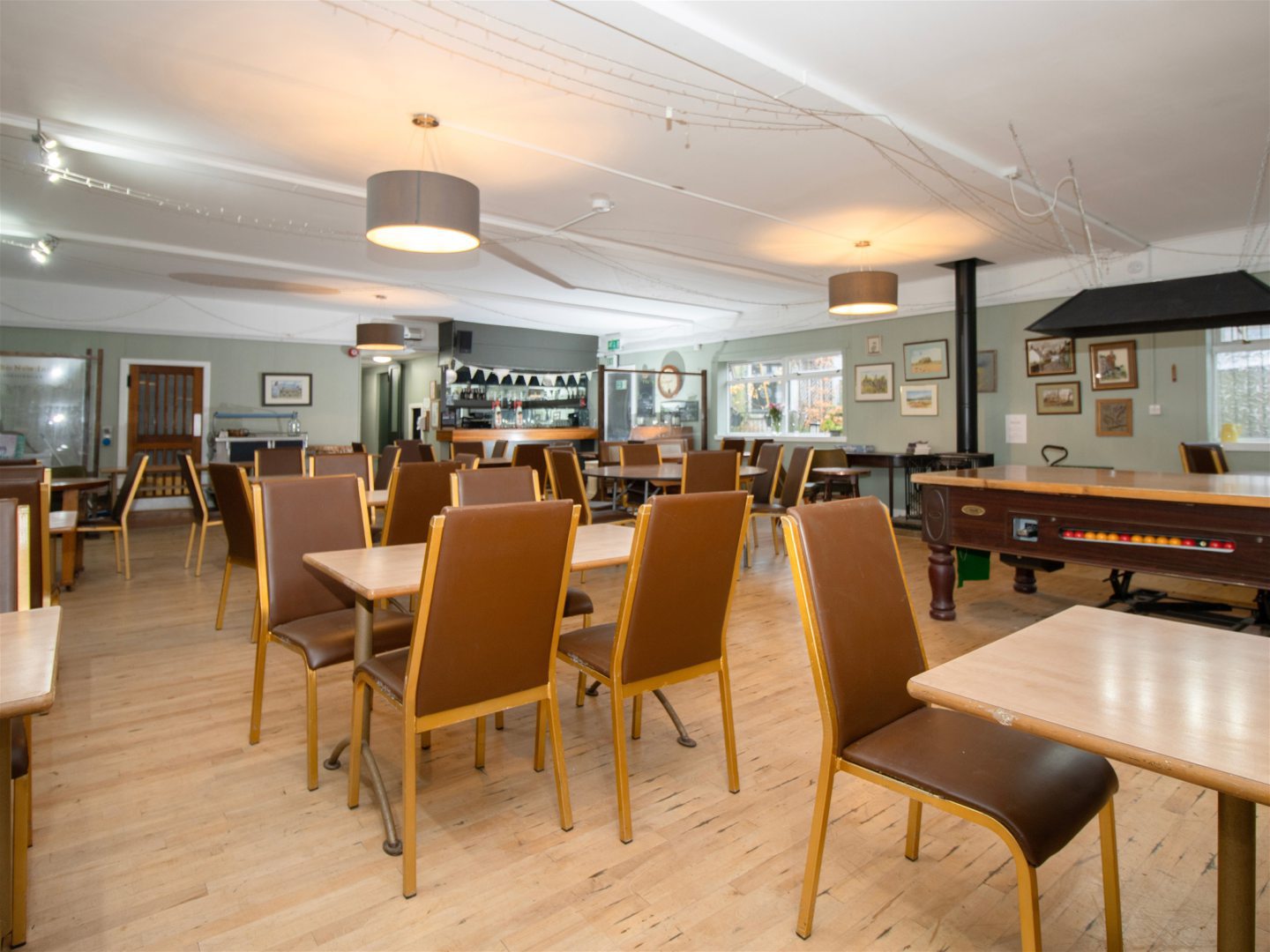 The substantial function room has a pool table.