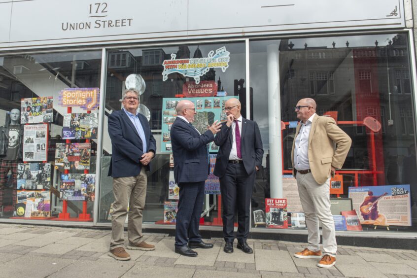 Bob Keiller (centre-left) explains the problems Union Street traders are facing to First Minister John Swinney (centre-right) Image: Jason Hedges/DC Thomson