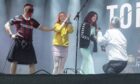 Man on one knee during Belladrum proposal.