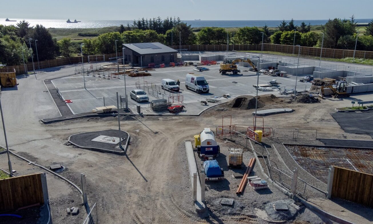 The Bridge of Don recycling centre with the sea in the background