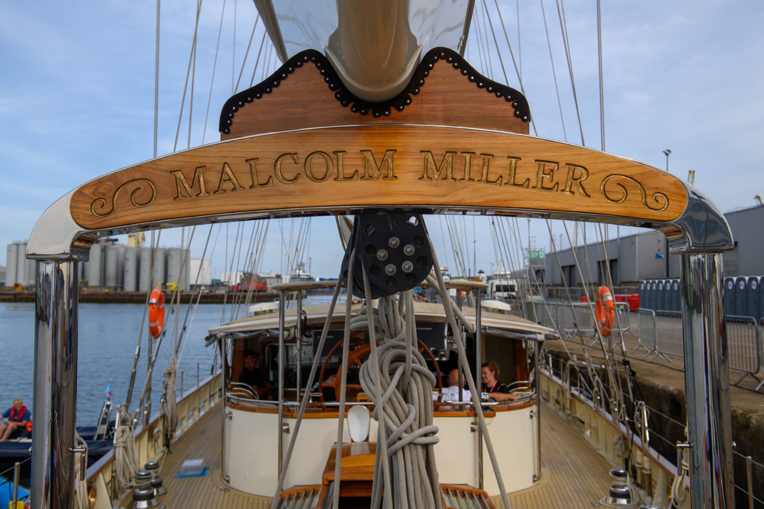 The name of the ship inscribed on a wooden panel.