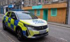 Police outside the cafe. Image: Kenny Elrick/DC Thomson