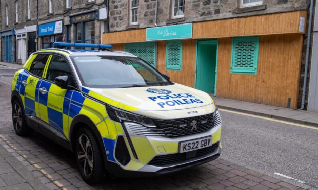 Police outside the cafe. Image: Kenny Elrick/DC Thomson