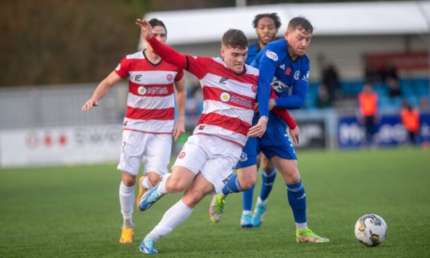 Forward Euan Henderson in action for Hamilton last season against Cove Rangers' Michael Doyle, is now leading the line for Airdrie. Image: Kath Flannery/DC Thomson.