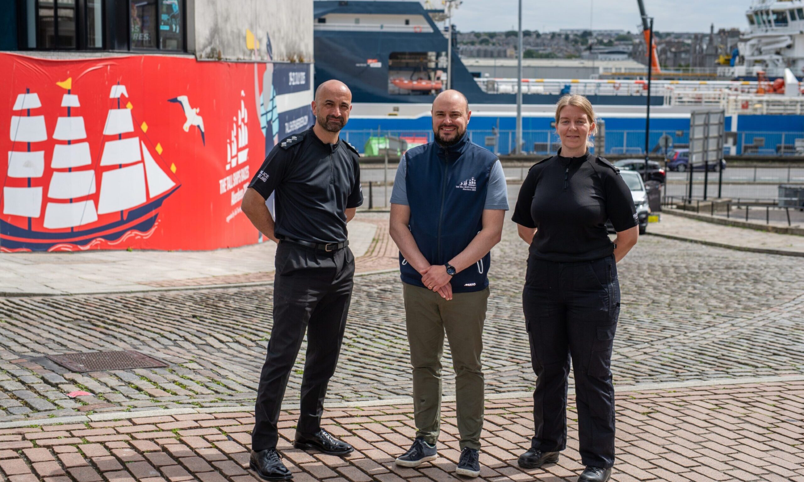 Chief Inspector Darren Bruce, left, alongside Stephen O'Neill of Aberdeen City Council, middle, and officer Hayley Stephens