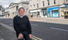 David White photographed in front of two previously empty Union Street units.