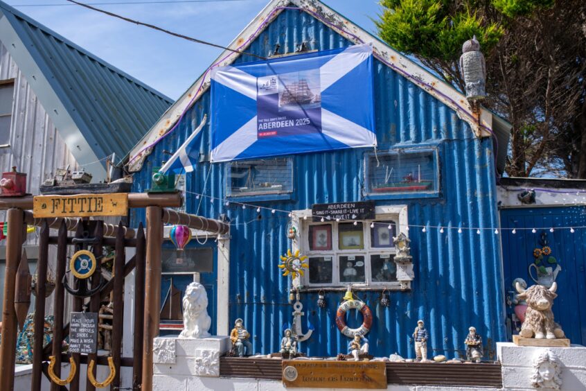 Tall Ships flag on blue building 