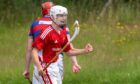 Kinlochshiel's Jay MacRae celebrates scoring the winning goal against Kingussie. Image: Neil G Paterson.