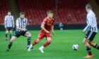 Aberdeen's Adam Emslie breaks away from Fraserburgh's Lewis Davidson in the Aberdeenshire Shield first round tie at Pittodrie Stadium, Aberdeen, on October 11, 2023.