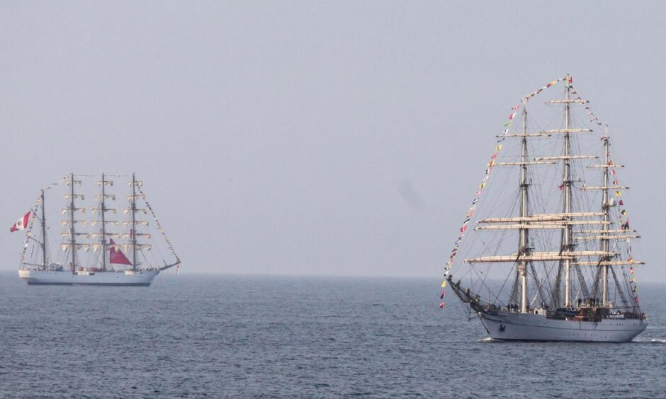 The Shabab Oman II arrives into Aberdeen as the BAP Union - a Peruvian navy training vessel - is anchored out at sea.