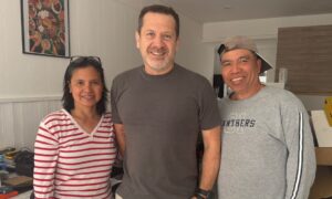 Naimas owners Jake Most (centre) with Marites and Eddie Belarmino.