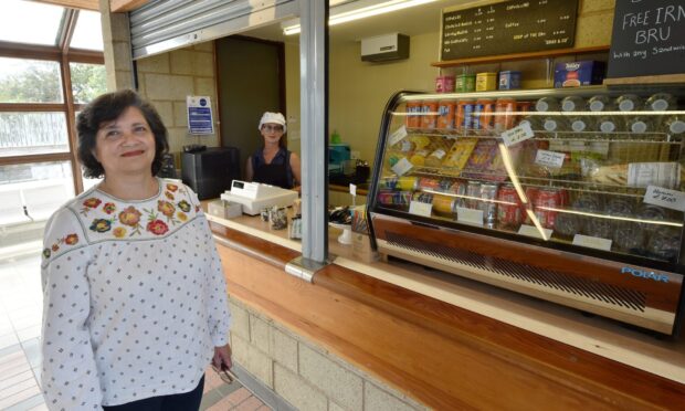 Lara Alsayed standing at Elgin station cafe counter.