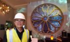 Garry Marsden, manager of The Inverness Castle Experience with the rose window. Image:  
Sandy McCook/DC Thomson