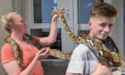 Faith Boyd and Calum McKenzie holding Athena.