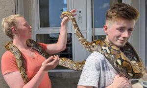 Faith Boyd and Calum McKenzie holding Athena.