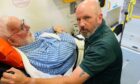 Patient Alan Minto with Clinical Team Leader Paramedic Stuart Richardson. Image: DC Thomson