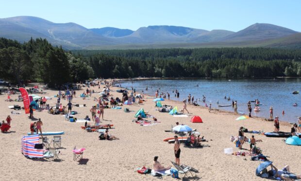 Crowds at Loch Morlich beach enjoying the weather. Image: Peter Jolly
