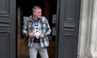 Aleksander Ostrowski was convicted of domestic abuse.