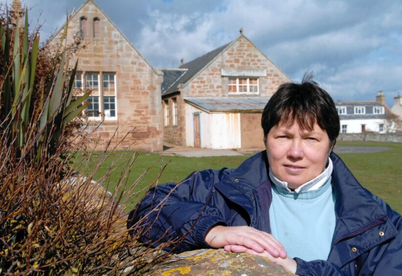 Liz Robertson in front of the old primary school turned community centre.