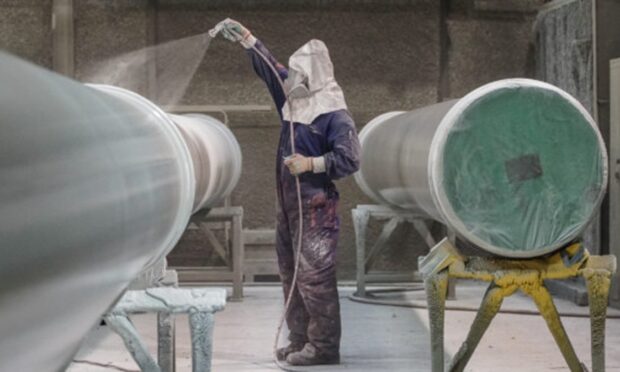 Spray coating in action at eBlast's Kintore facility. Image: eGroup