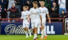 Aberdeen's Adil Aouchiche looks dejected after Graeme Shinnie scores an own goal to make it 1-0 to Hearts.