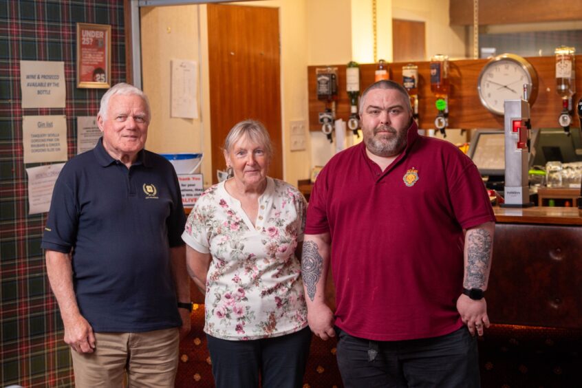 Fred Small, Hazel Morrison and George Stewart inside the social club. 