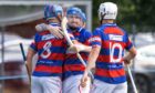 Kingussie's Dylan Borthwick (centre) celebrates the opening goal within 2 minutes of the start of the game.  Image: Neil Paterson.