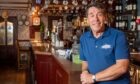 Garlogie Inn owner Nick Quinn at the venue's bar.