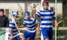 Newtonmore's Matthew Sloss celebrates getting the fourth goal to secure the semi final win.  Image: Neil Paterson
