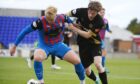 Caley Thistle's Luis Longstaff is challenged by Peterhead trialist Flynn Duffy in ICT's 2-0 SPFL League One win at the Caledonian Stadium, Inverness, on August 9, 2025.