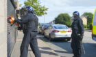 Police raid a premises in Northfield with alleged links to a crack cocaine gang. Image: Angus Webster/DC Thomson