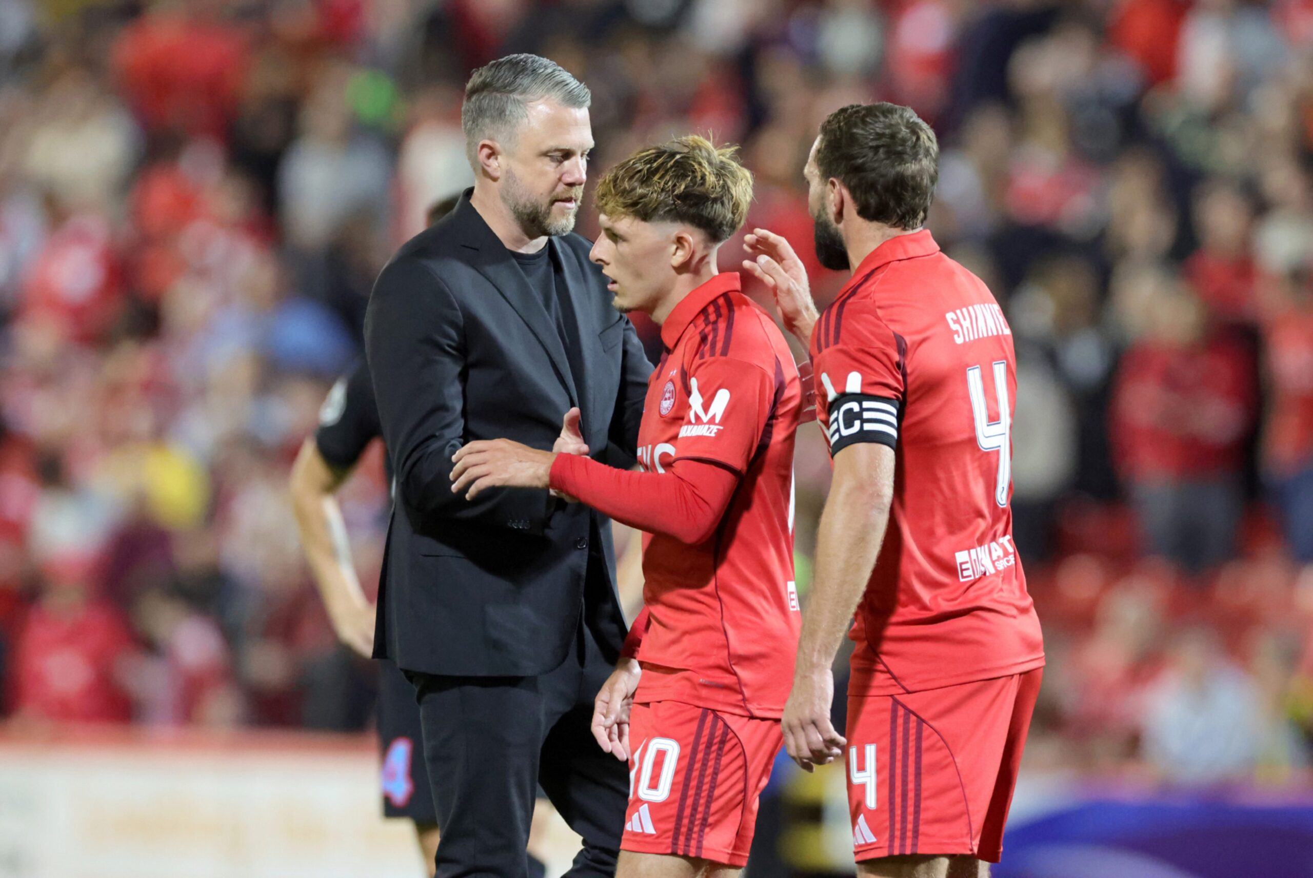 Aberdeen's manager Jimmy Thelin with the players after the final whistle in the UEFA Europa League play-off match. Image: PA