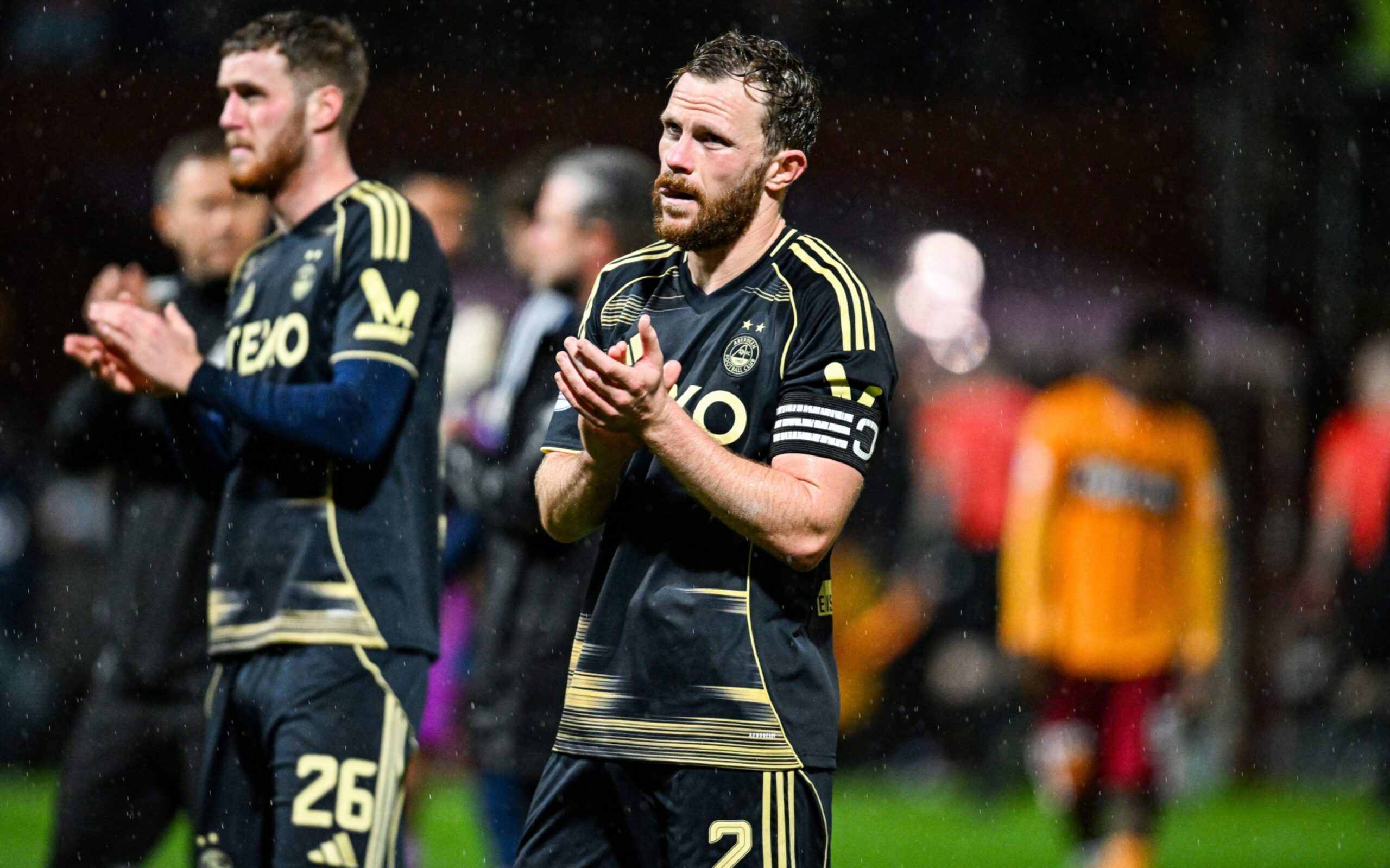 Aberdeen's Nicky Devlin applauds fans at full time after the 2-0 loss to Motherwell. Image: SNS 