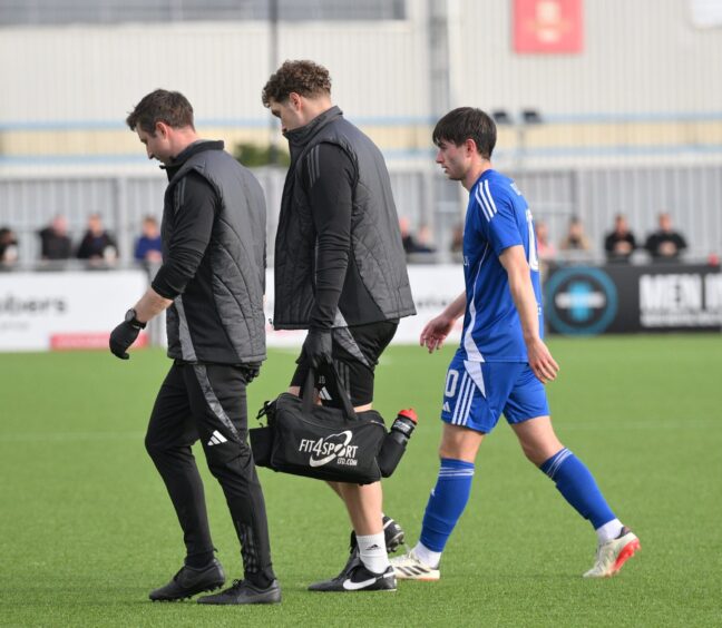 Cove Rangers midfielder Declan Glass comes off the pitch after picking up a knock against Inverness Caledonian Thistle in an SPFL League One match at the Balmoral Stadium, Cove, Aberdeen, on September 13, 2025. 