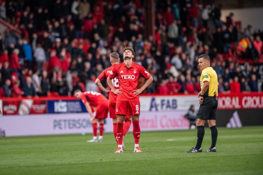 Aberdeen's Dante Polvara and Ante Palaversa look dejected at full time after the 0-0 draw with Livingston.