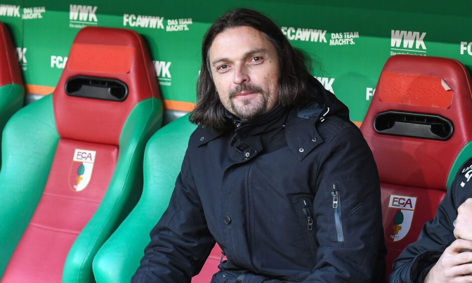 A smiling Lutz Pfannenstiel in the dugout at Dusseldorf