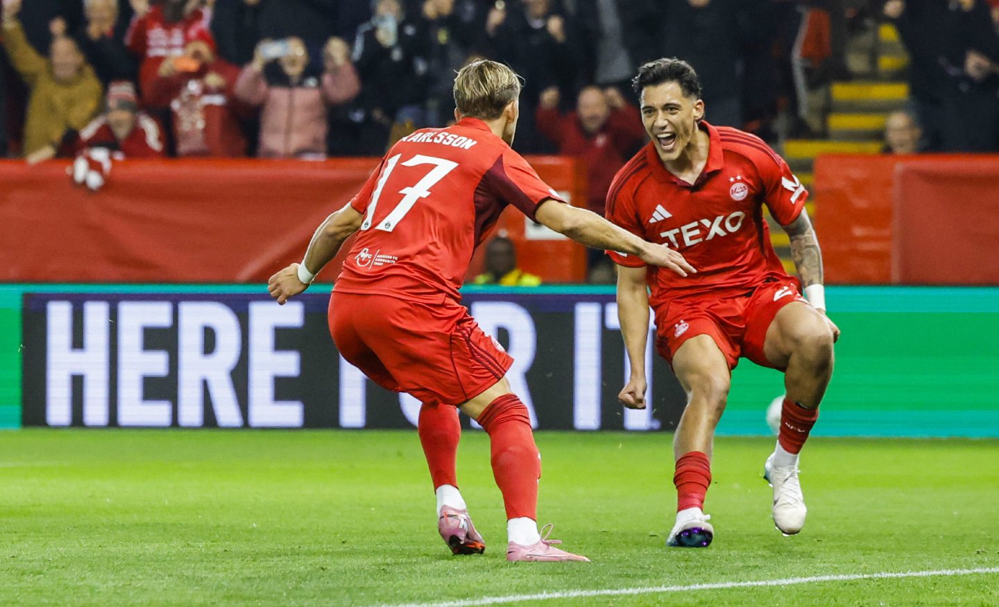 Aberdeen's Jesper Karlsson (L) celebrates with Marko Lazetic (R) after scoring from the penalty spot to make it 1-0 against Shakhtar Donetsk. 